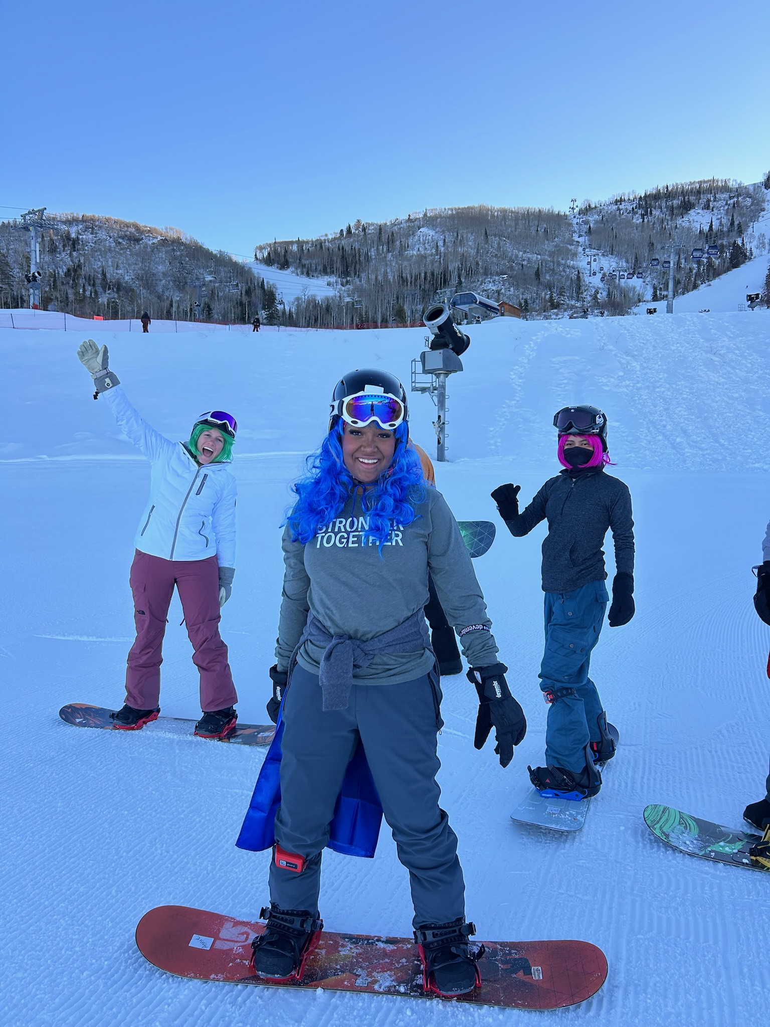 Winter Burn Camp participants posing with snowboards at Steamboat