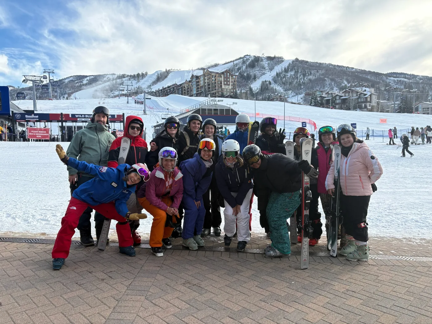 Winter Camp skiers and snowboarders gathered together at the base of the mountain